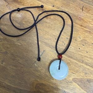 Green jadeite jade donut pendant necklace